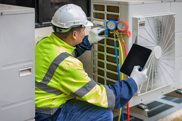 Professional Ac Installation technician working in Amana, IA